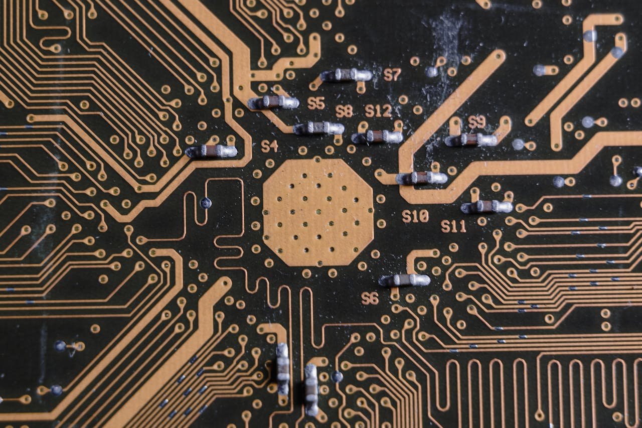 about-me-img Detailed image of a printed circuit board highlighting electronic pathways and components.