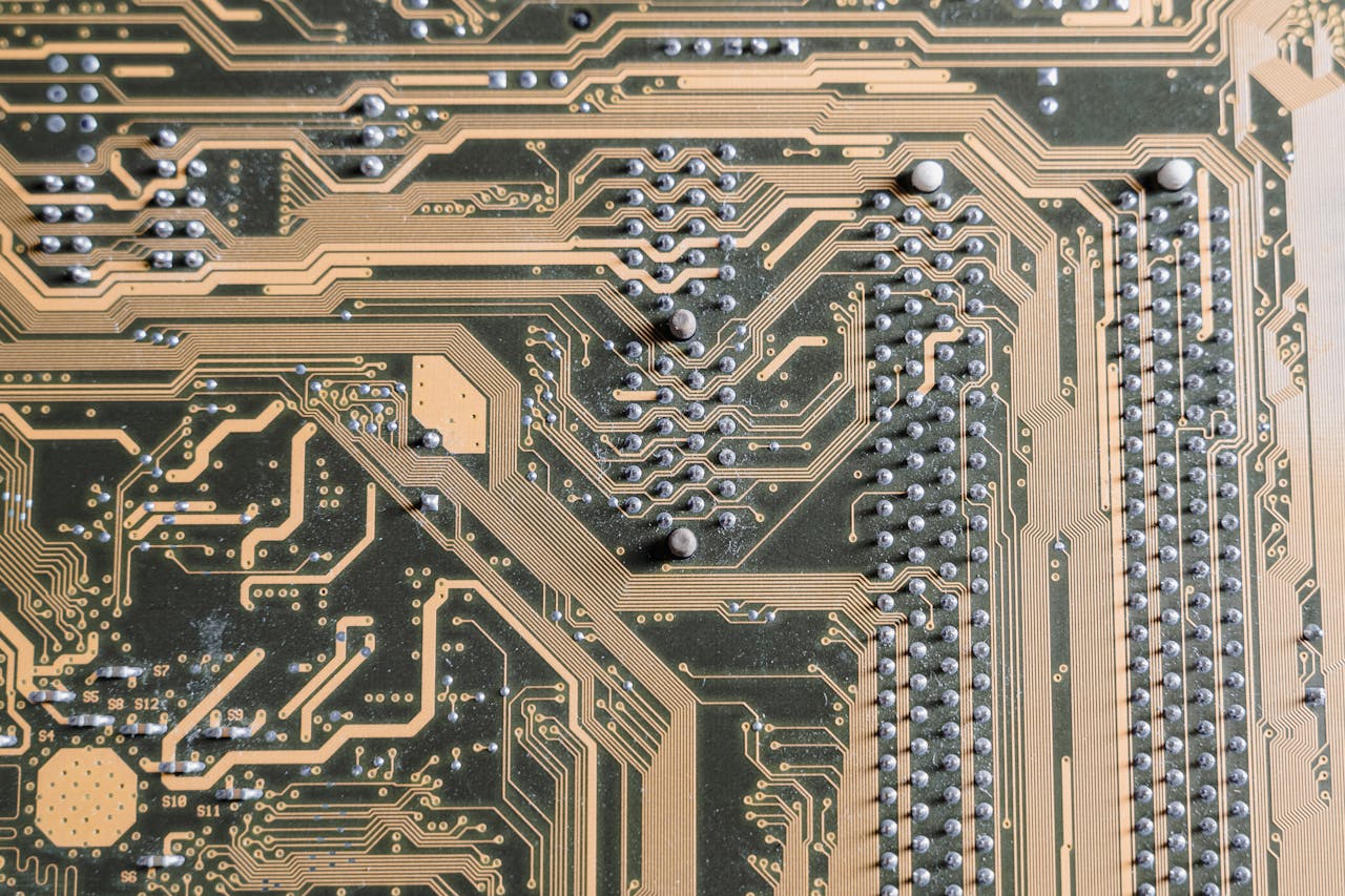 hero-img Detailed view of intricate circuitry on a computer motherboard.